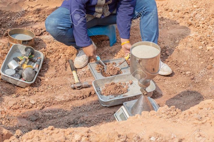 a man is doing Soil Testing 